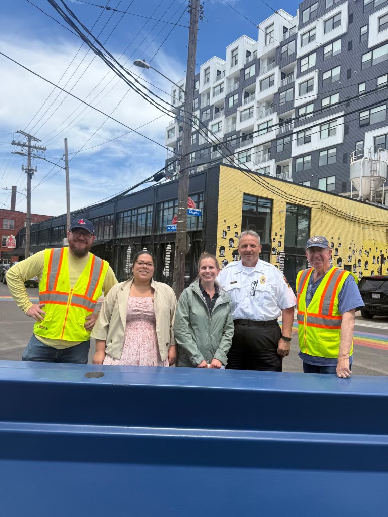 Haven team with public safety officer behind a deployed barrier